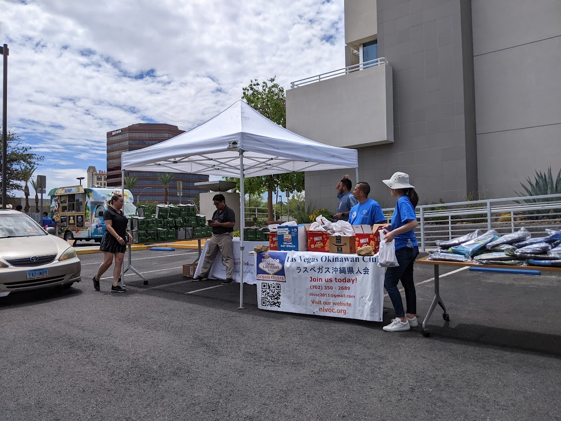 Volunteers greet families at the check-in tent